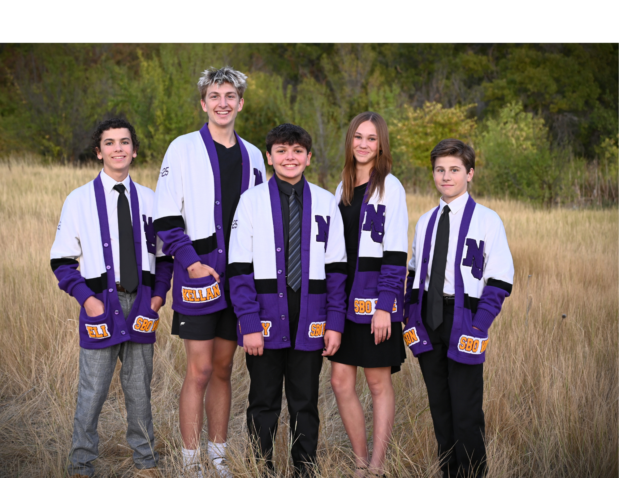 5 SBO Officers in a field wearing white and purple jackets