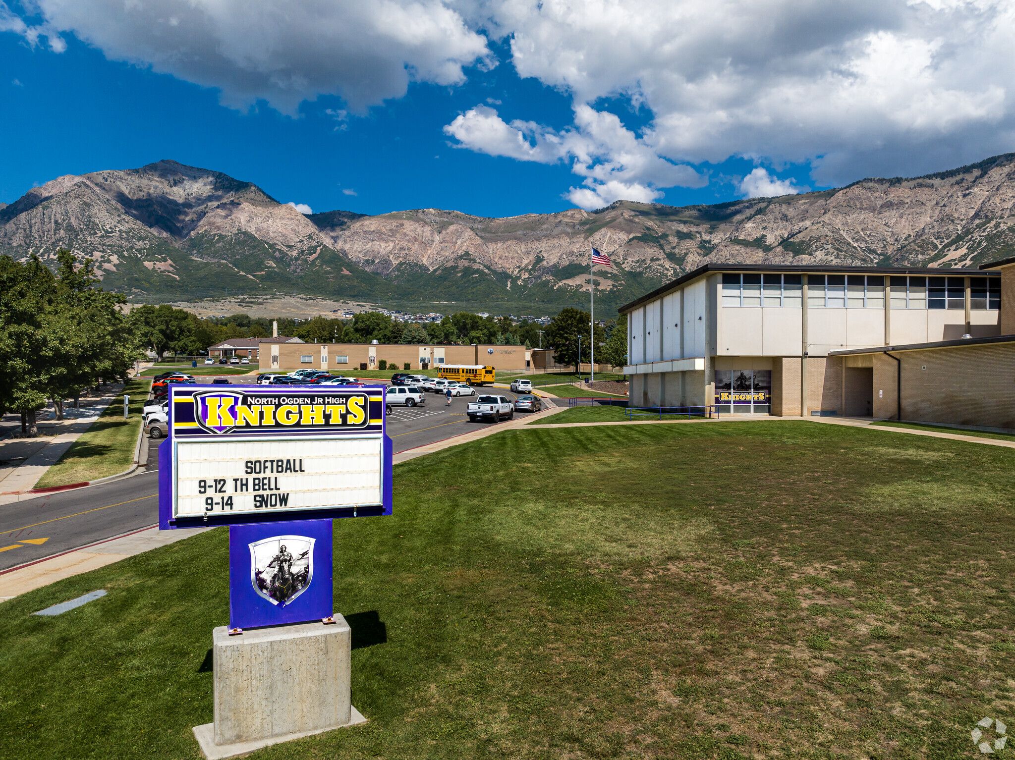 a pruple sign and the side view of north ogden jr high